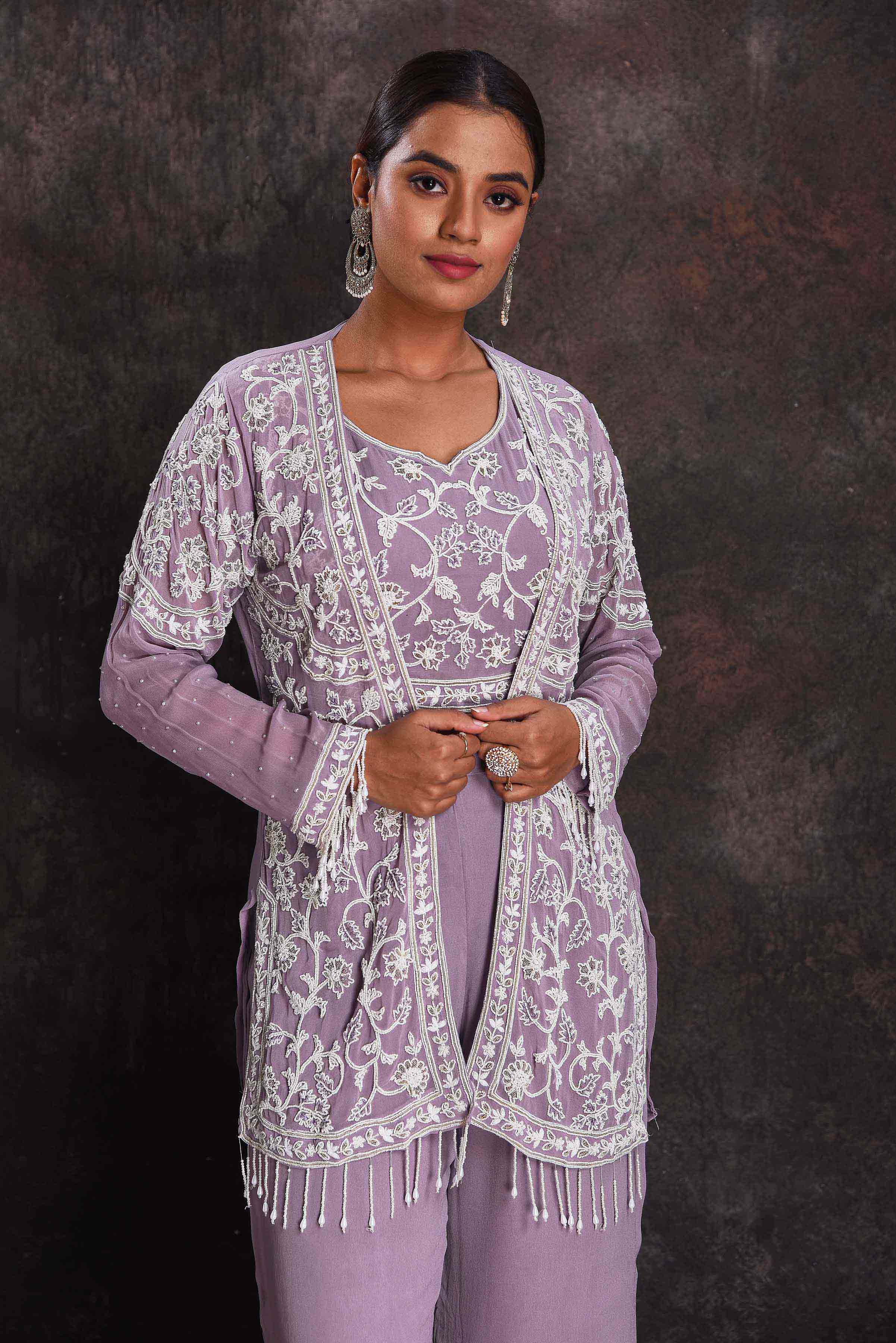 Shop beautiful lavender embroidered crop top and palazzo online in USA with shrug. Look your ethnic best on festive occasions with latest designer sarees, pure silk sarees, Kanchipuram silk sarees, designer dresses, Anarkali suits, gown, embroidered sarees from Pure Elegance Indian fashion store in USA.-closeup