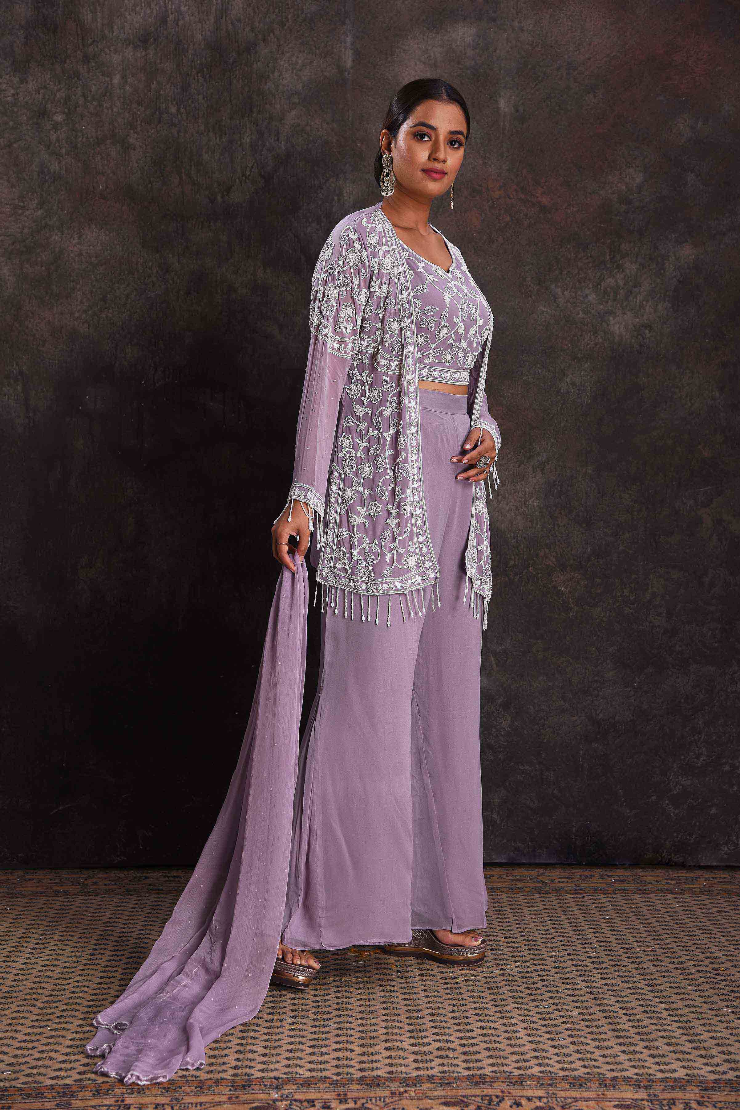 Shop beautiful lavender embroidered crop top and palazzo online in USA with shrug. Look your ethnic best on festive occasions with latest designer sarees, pure silk sarees, Kanchipuram silk sarees, designer dresses, Anarkali suits, gown, embroidered sarees from Pure Elegance Indian fashion store in USA.-right