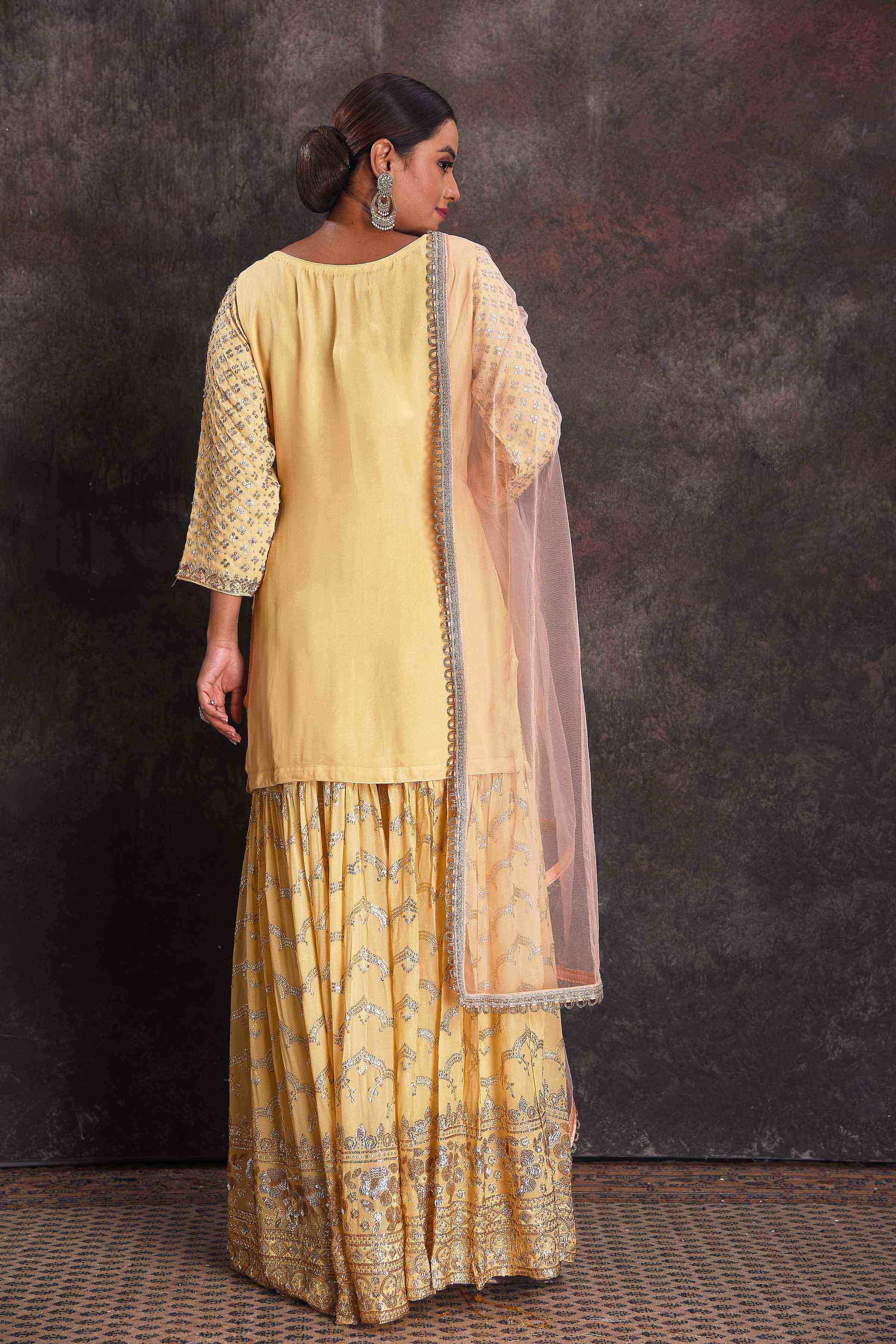 Buy beautiful lemon yellow embroidered sharara suit online in USA with dupatta. Look your ethnic best on festive occasions with latest designer sarees, pure silk sarees, Kanchipuram silk sarees, designer dresses, Anarkali suits, gown, embroidered sarees from Pure Elegance Indian fashion store in USA.-back