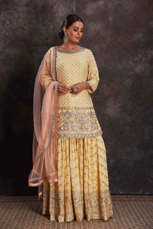 Buy beautiful lemon yellow embroidered sharara suit online in USA with dupatta. Look your ethnic best on festive occasions with latest designer sarees, pure silk sarees, Kanchipuram silk sarees, designer dresses, Anarkali suits, gown, embroidered sarees from Pure Elegance Indian fashion store in USA.-front
