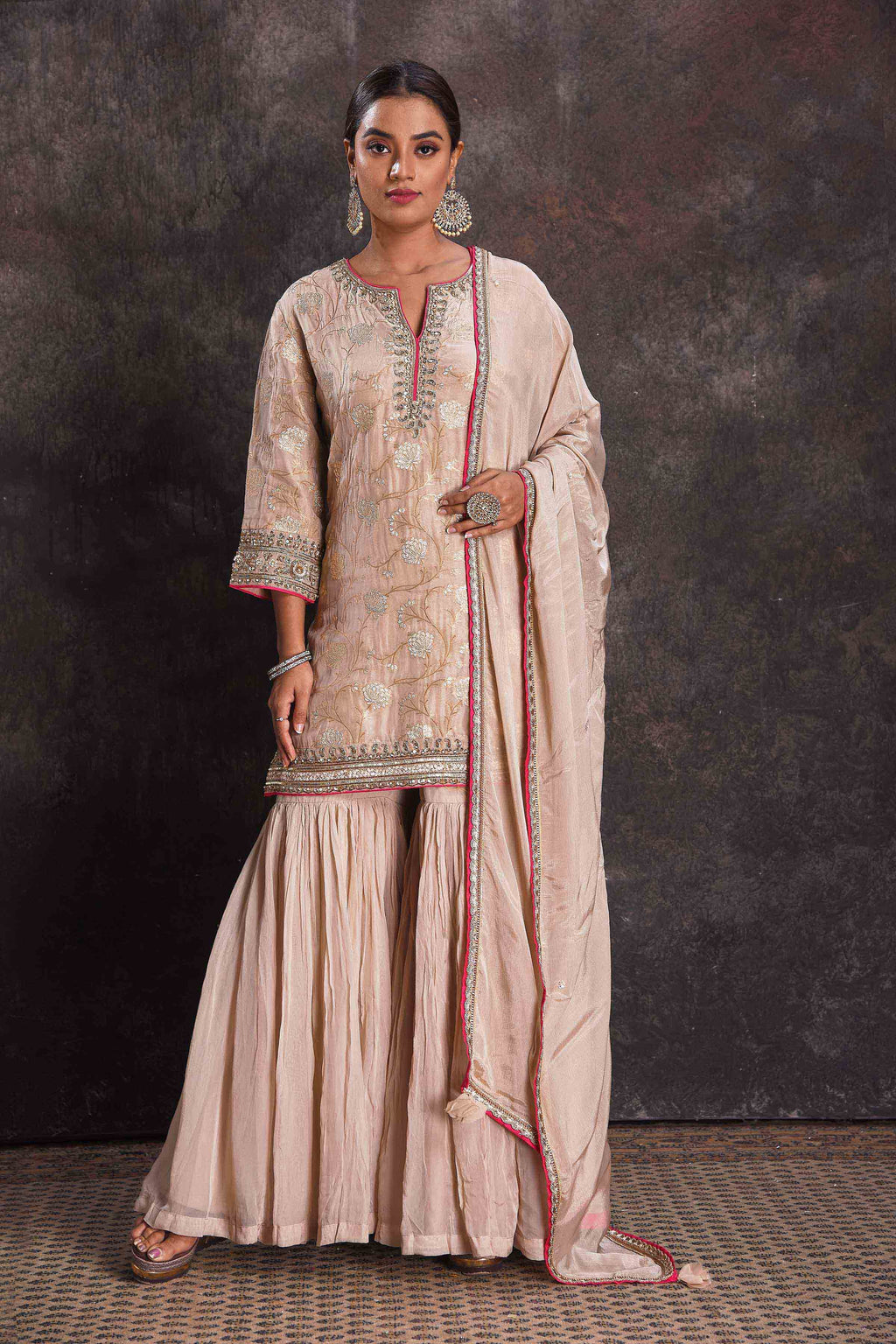 Shop stunning powder pink designer embroidered sharara suit online in USA with dupatta. Look your ethnic best on festive occasions with latest designer sarees, pure silk sarees, Kanchipuram silk sarees, designer dresses, Anarkali suits, gown, embroidered sarees from Pure Elegance Indian fashion store in USA.-full view