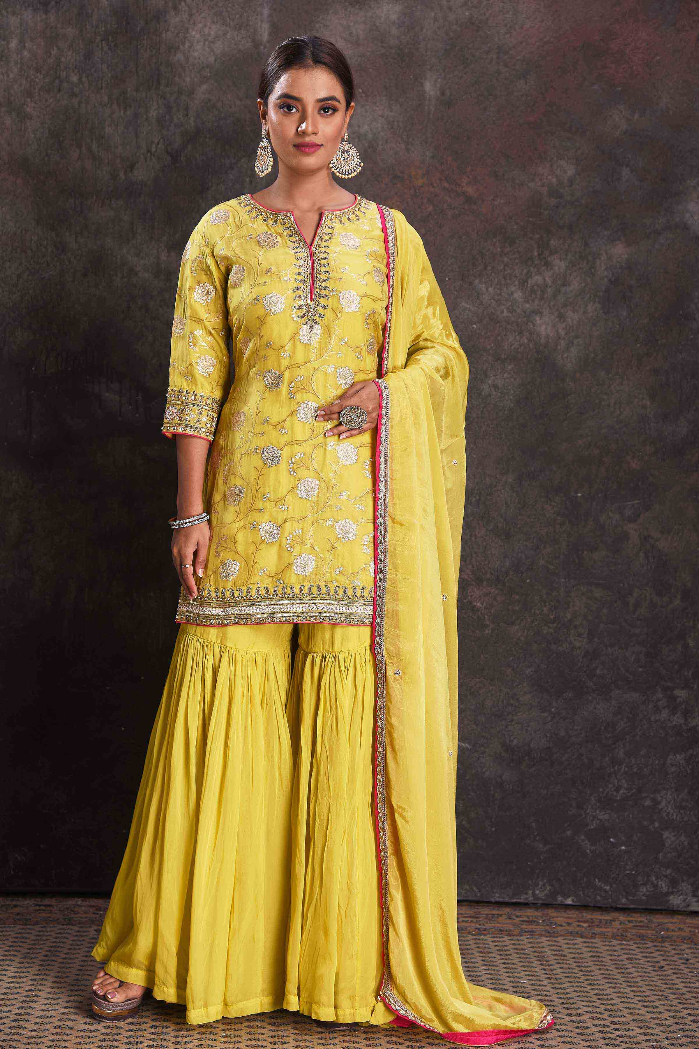 Buy beautiful bright yellow designer embroidered gharara suit online in USA with dupatta. Look your ethnic best on festive occasions with latest designer sarees, pure silk sarees, Kanchipuram silk sarees, designer dresses, Anarkali suits, gown, embroidered sarees from Pure Elegance Indian fashion store in USA.-full view