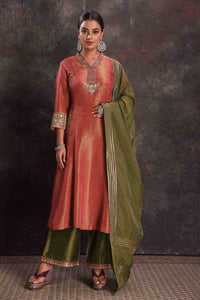 Buy stunning metallic orange embroidered Anarkali suit online in USA with green dupatta. Look your ethnic best on festive occasions with latest designer sarees, pure silk sarees, Kanchipuram silk sarees, designer dresses, Anarkali suits, gown, embroidered sarees from Pure Elegance Indian fashion store in USA.-full view