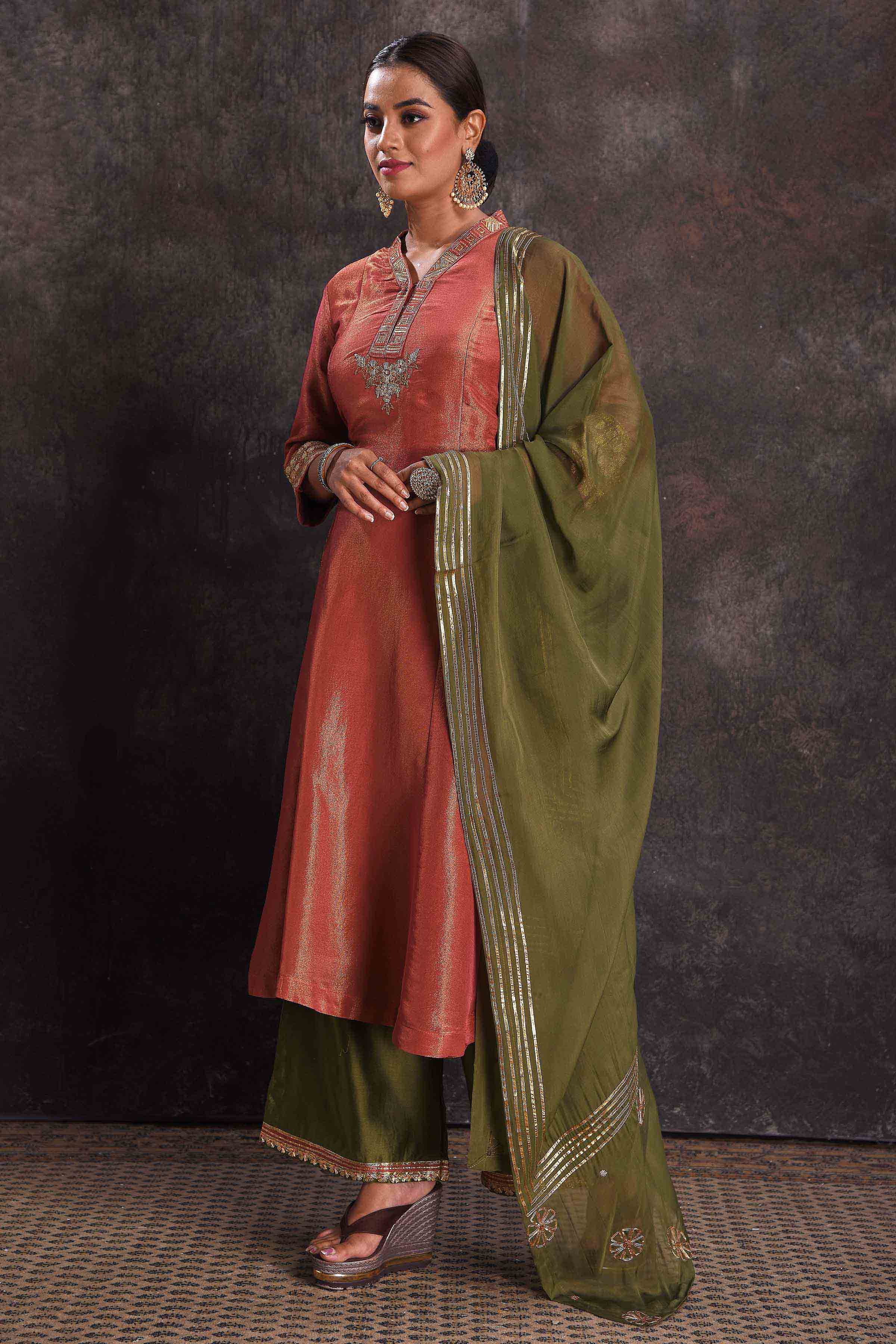 Buy stunning metallic orange embroidered Anarkali suit online in USA with green dupatta. Look your ethnic best on festive occasions with latest designer sarees, pure silk sarees, Kanchipuram silk sarees, designer dresses, Anarkali suits, gown, embroidered sarees from Pure Elegance Indian fashion store in USA.-dupatta