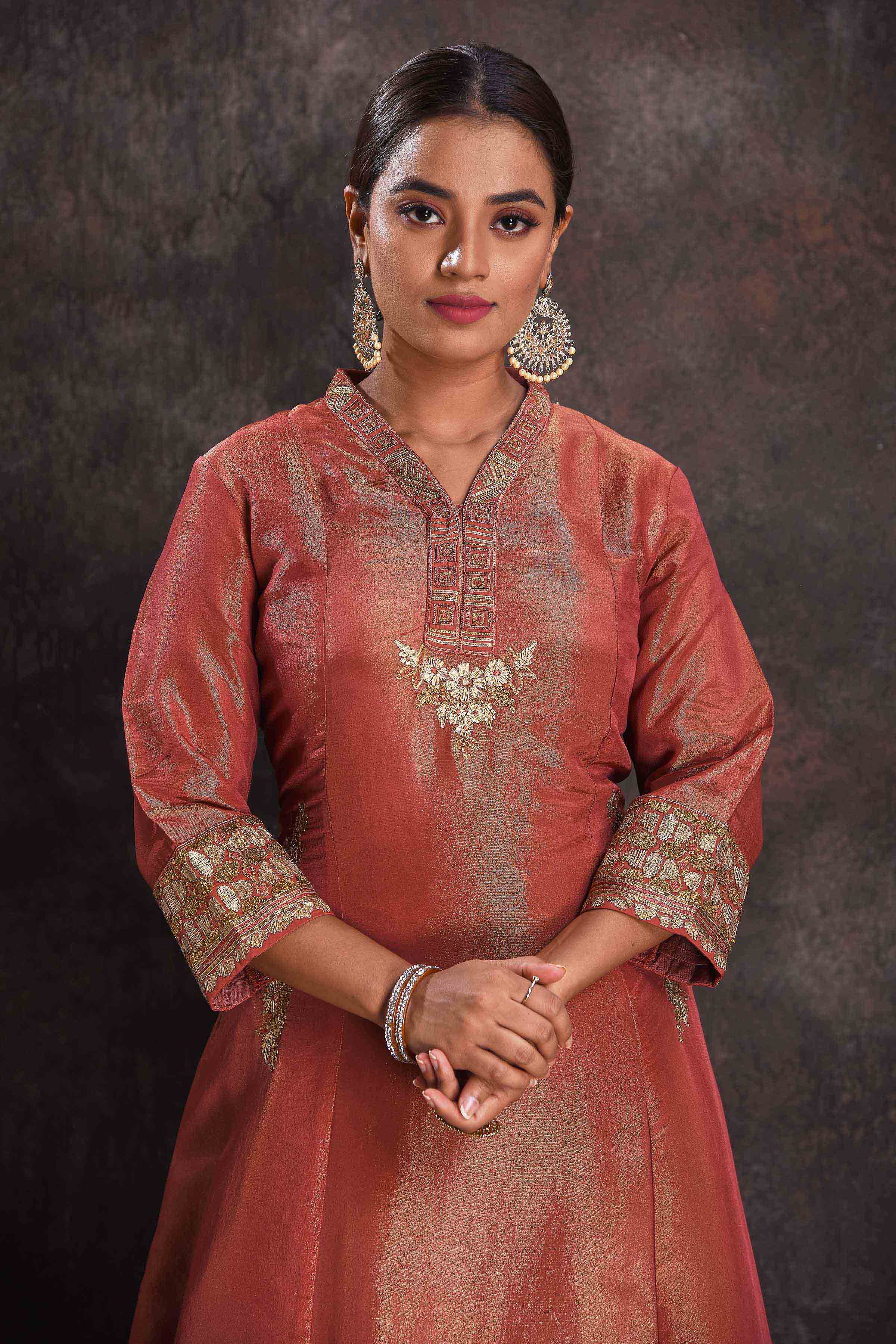 Buy stunning metallic orange embroidered Anarkali suit online in USA with green dupatta. Look your ethnic best on festive occasions with latest designer sarees, pure silk sarees, Kanchipuram silk sarees, designer dresses, Anarkali suits, gown, embroidered sarees from Pure Elegance Indian fashion store in USA.-closeup