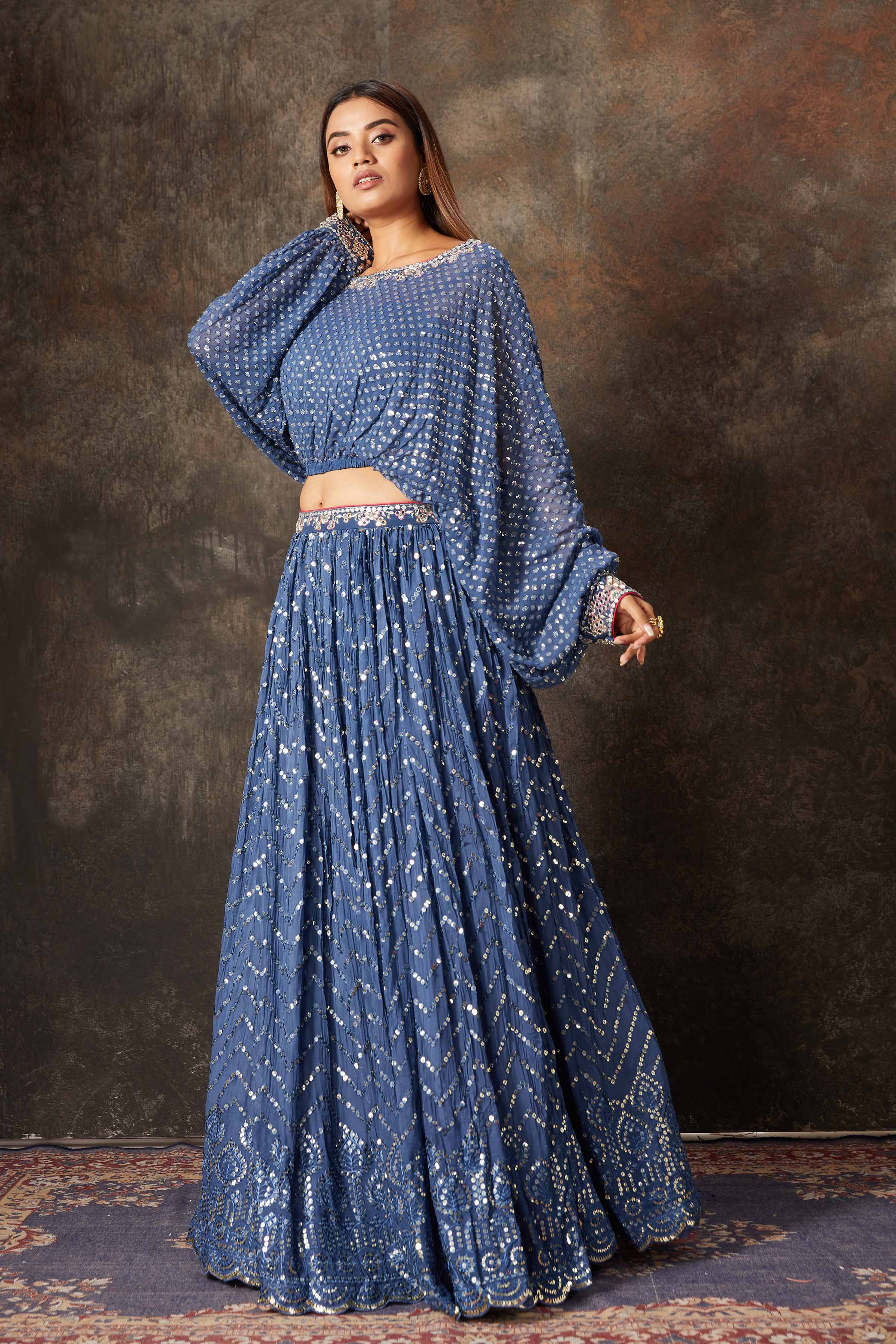 Shop beautiful blue embroidered designer skirt set online in USA. Look stylish at parties and special occasions in beautiful designer sarees, embroidered sarees, handwoven silk, party sarees, lehengas, Anarkali suits from Pure Elegance Indian fashion store in USA.-left side