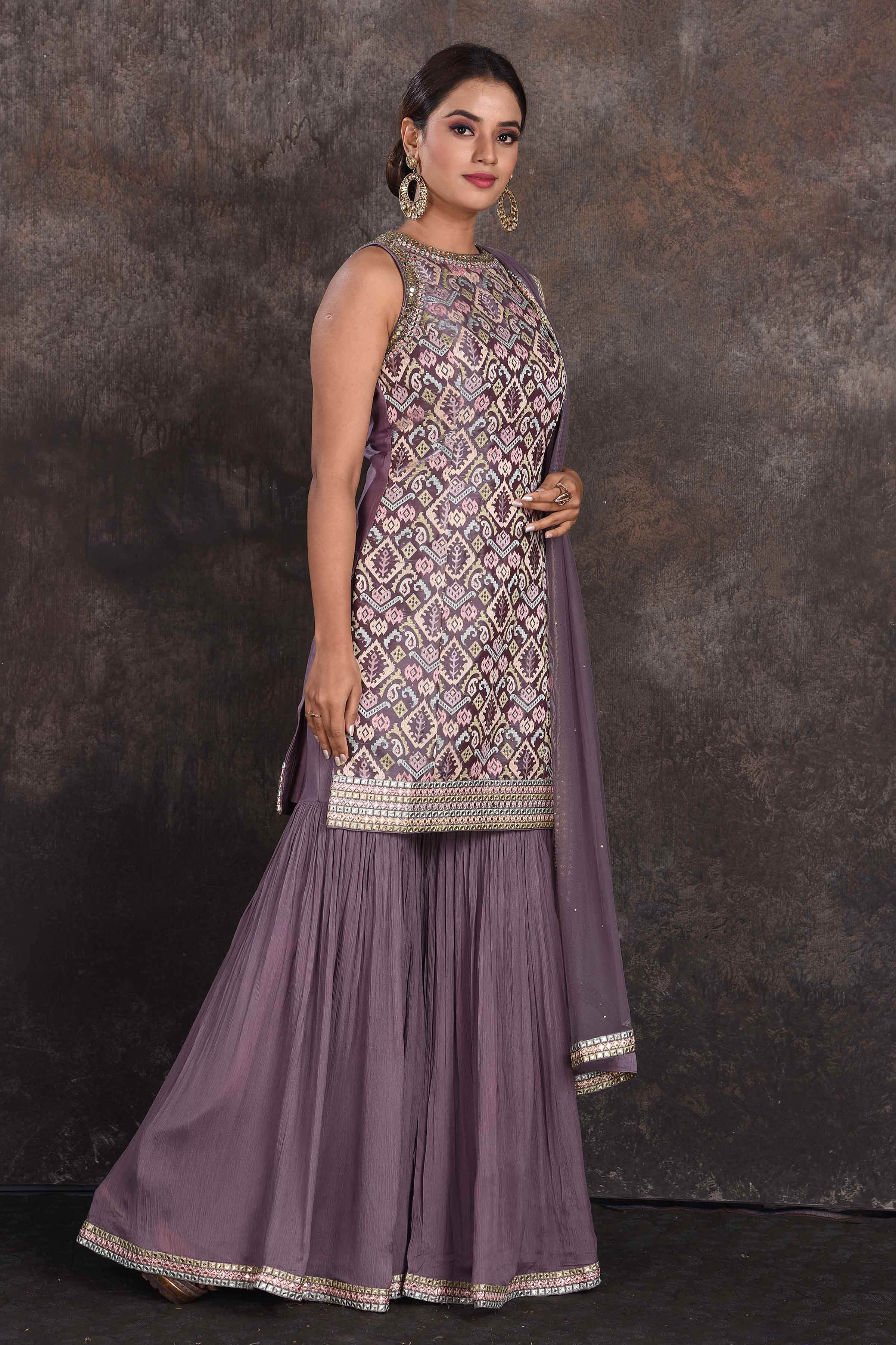 Shop stunning grey embellished designer sharara suit online in USA with dupatta. Be the star of the occasion in this stylish designer lehengas, designer gowns, Indowestern dresses, Anarkali suits, sharara suits from Pure Elegance Indian fashion store in USA.-right