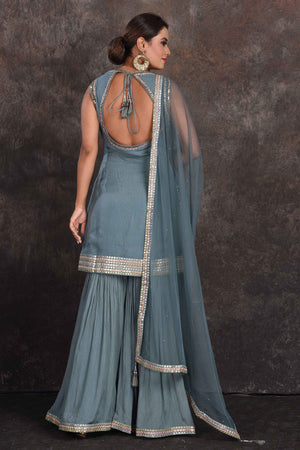 Buy beautiful sage green embellished designer sharara suit online in USA with dupatta. Be the star of the occasion in this stylish designer lehengas, designer gowns, Indowestern dresses, Anarkali suits, sharara suits from Pure Elegance Indian fashion store in USA.-back