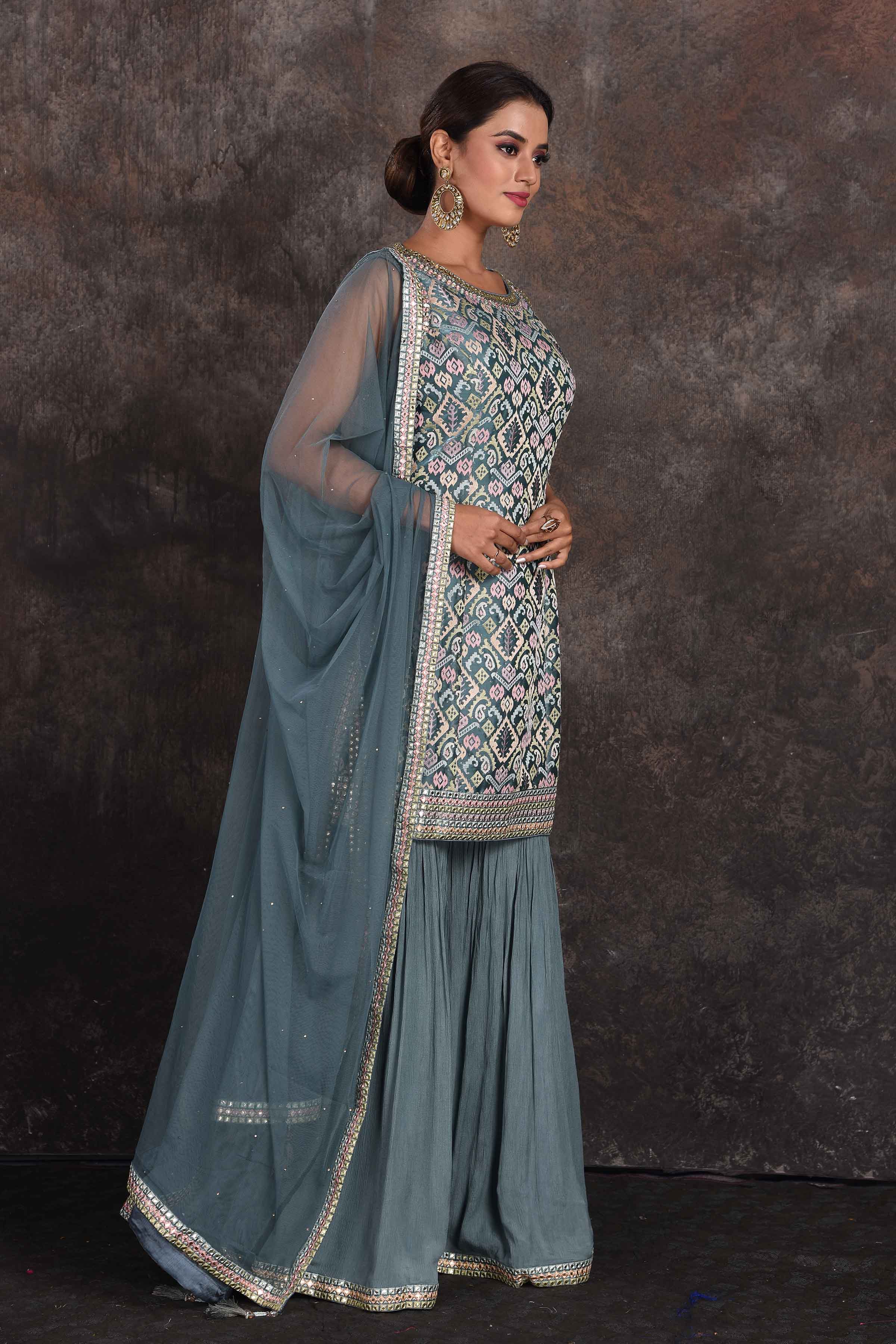Buy beautiful sage green embellished designer sharara suit online in USA with dupatta. Be the star of the occasion in this stylish designer lehengas, designer gowns, Indowestern dresses, Anarkali suits, sharara suits from Pure Elegance Indian fashion store in USA.-side
