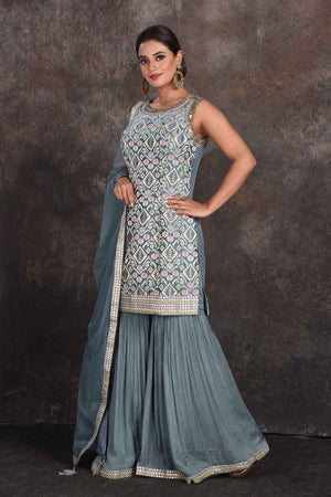 Buy beautiful sage green embellished designer sharara suit online in USA with dupatta. Be the star of the occasion in this stylish designer lehengas, designer gowns, Indowestern dresses, Anarkali suits, sharara suits from Pure Elegance Indian fashion store in USA.-left