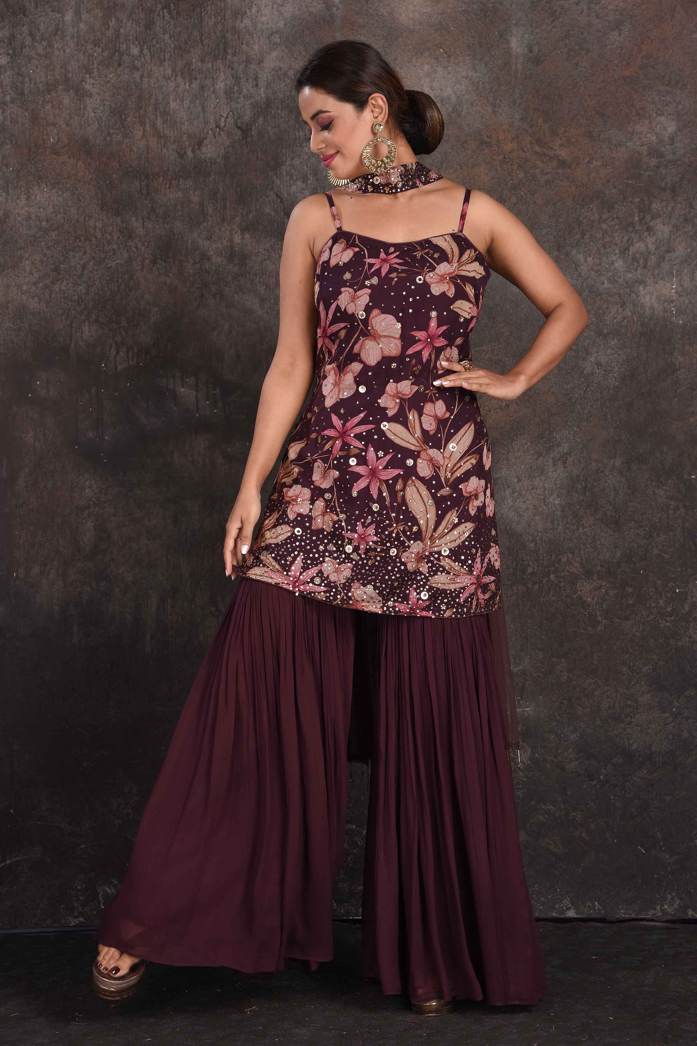 Buy beautiful wine color embellished floral gharara suit online in USA with dupatta. Be the star of the occasion in this stylish designer lehengas, designer gowns, Indowestern dresses, Anarkali suits, sharara suits from Pure Elegance Indian fashion store in USA.-front