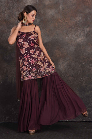 Buy beautiful wine color embellished floral gharara suit online in USA with dupatta. Be the star of the occasion in this stylish designer lehengas, designer gowns, Indowestern dresses, Anarkali suits, sharara suits from Pure Elegance Indian fashion store in USA.-gharara