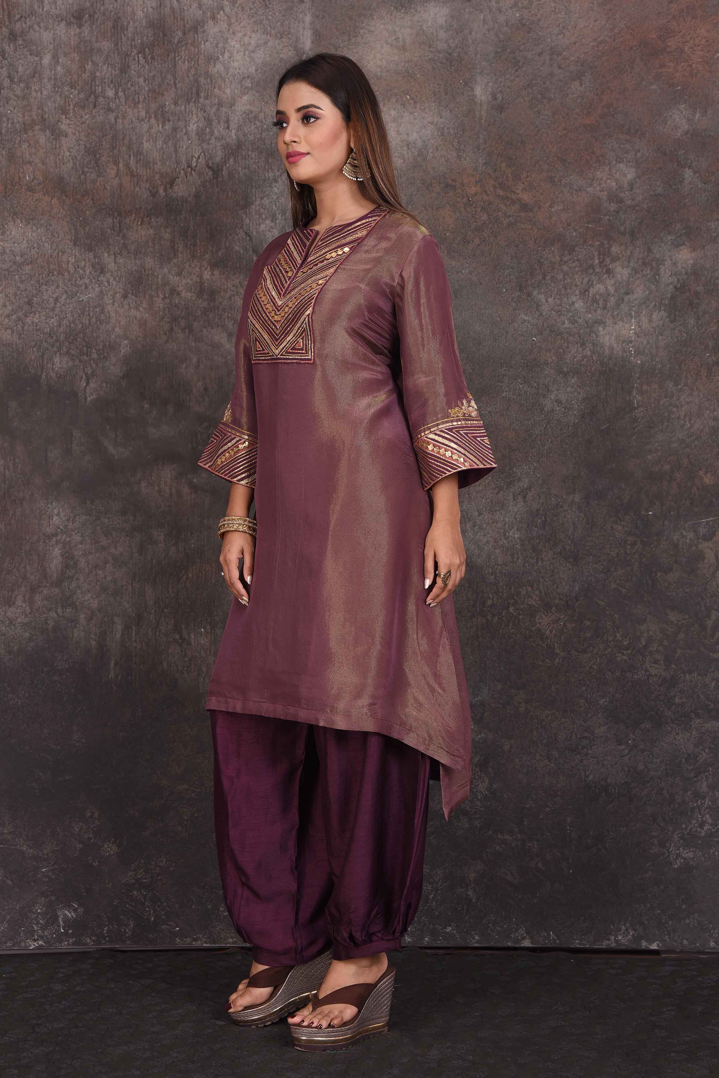 Buy beautiful golden purple embroidered salwar suit online in USA. Be the star of the occasion in this stylish designer lehengas, designer gowns, Indowestern dresses, Anarkali suits, sharara suits from Pure Elegance Indian fashion store in USA.-side