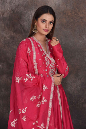Shop bright pink embroidered Anarkali suit online in USA with dupatta. Be the star of the occasion in this stylish designer lehengas, designer gowns, Indowestern dresses, Anarkali suits, sharara suits from Pure Elegance Indian fashion store in USA.-closeup