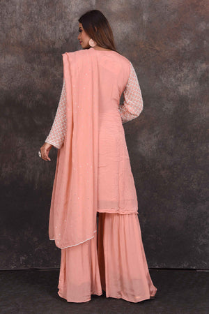 Buy peach embroidered sharara suit online in USA with dupatta. Be the star of the occasion in this stylish designer lehengas, designer gowns, Indowestern dresses, Anarkali suits, sharara suits from Pure Elegance Indian fashion store in USA.-back