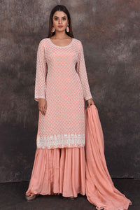 Buy peach embroidered sharara suit online in USA with dupatta. Be the star of the occasion in this stylish designer lehengas, designer gowns, Indowestern dresses, Anarkali suits, sharara suits from Pure Elegance Indian fashion store in USA.-full view
