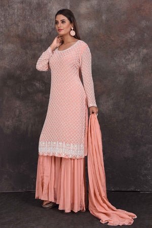 Buy peach embroidered sharara suit online in USA with dupatta. Be the star of the occasion in this stylish designer lehengas, designer gowns, Indowestern dresses, Anarkali suits, sharara suits from Pure Elegance Indian fashion store in USA.-side