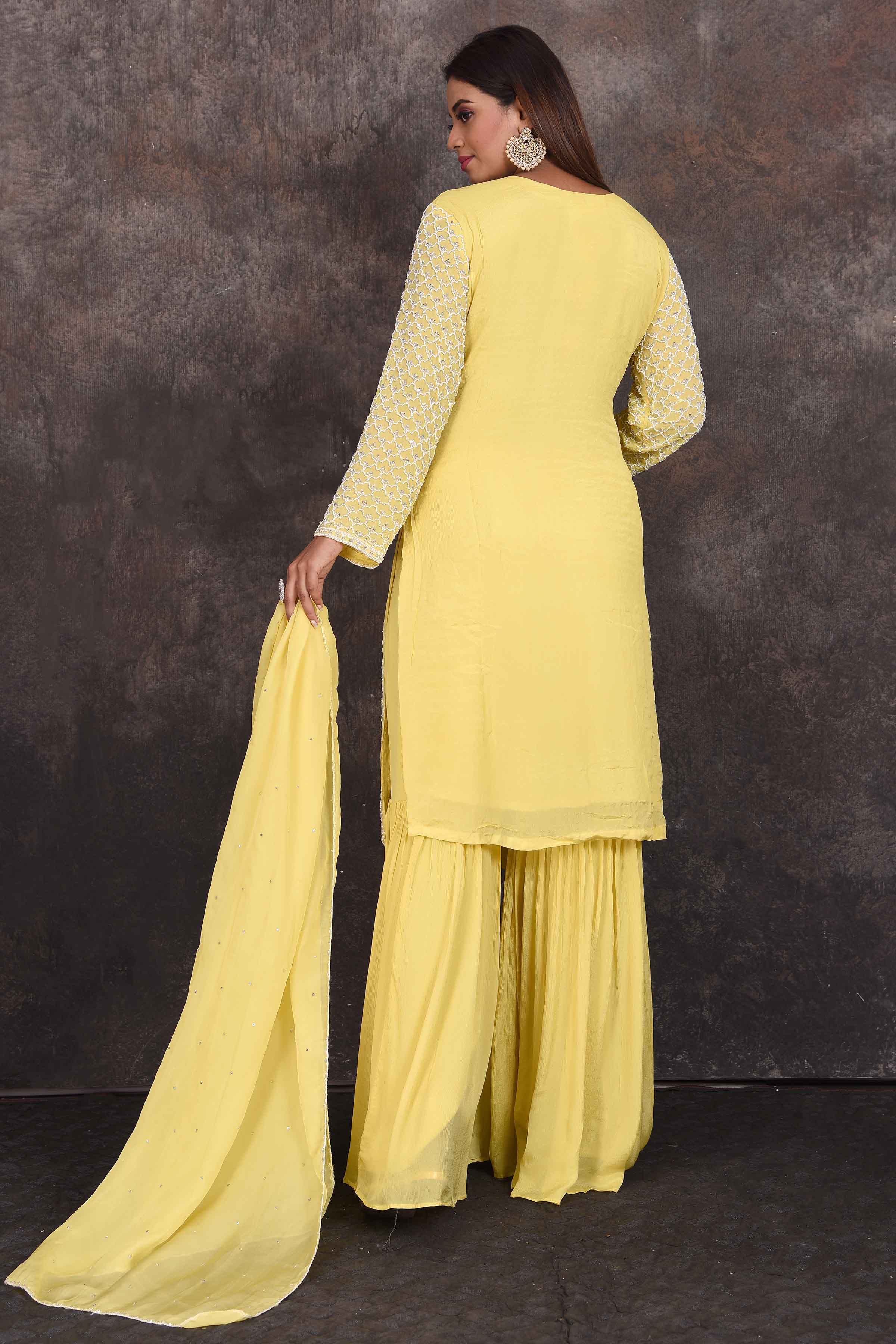 Shop beautiful lemon yellow embroidered sharara suit online in USA with dupatta. Be the star of the occasion in this stylish designer lehengas, designer gowns, Indowestern dresses, Anarkali suits, sharara suits from Pure Elegance Indian fashion store in USA.-back