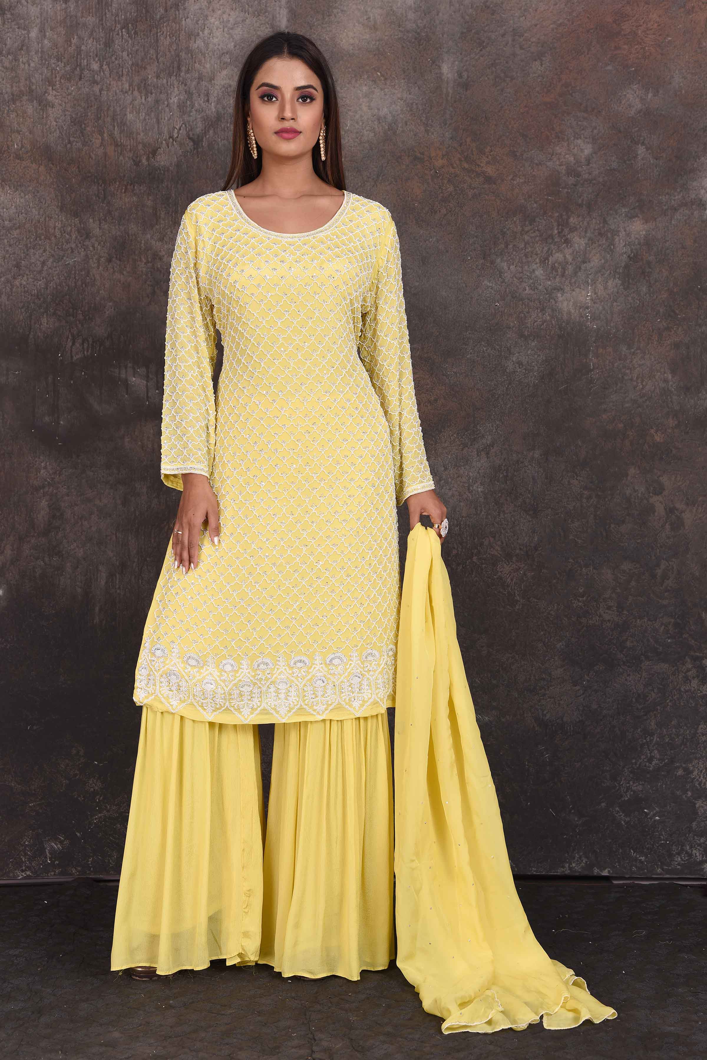 Shop beautiful lemon yellow embroidered sharara suit online in USA with dupatta. Be the star of the occasion in this stylish designer lehengas, designer gowns, Indowestern dresses, Anarkali suits, sharara suits from Pure Elegance Indian fashion store in USA.-full view