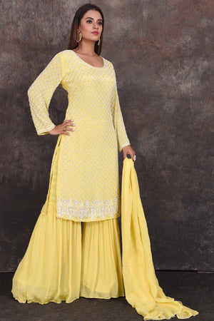 Shop beautiful lemon yellow embroidered sharara suit online in USA with dupatta. Be the star of the occasion in this stylish designer lehengas, designer gowns, Indowestern dresses, Anarkali suits, sharara suits from Pure Elegance Indian fashion store in USA.-side