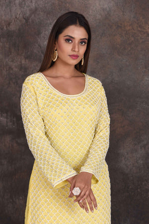 Shop beautiful lemon yellow embroidered sharara suit online in USA with dupatta. Be the star of the occasion in this stylish designer lehengas, designer gowns, Indowestern dresses, Anarkali suits, sharara suits from Pure Elegance Indian fashion store in USA.-closeup