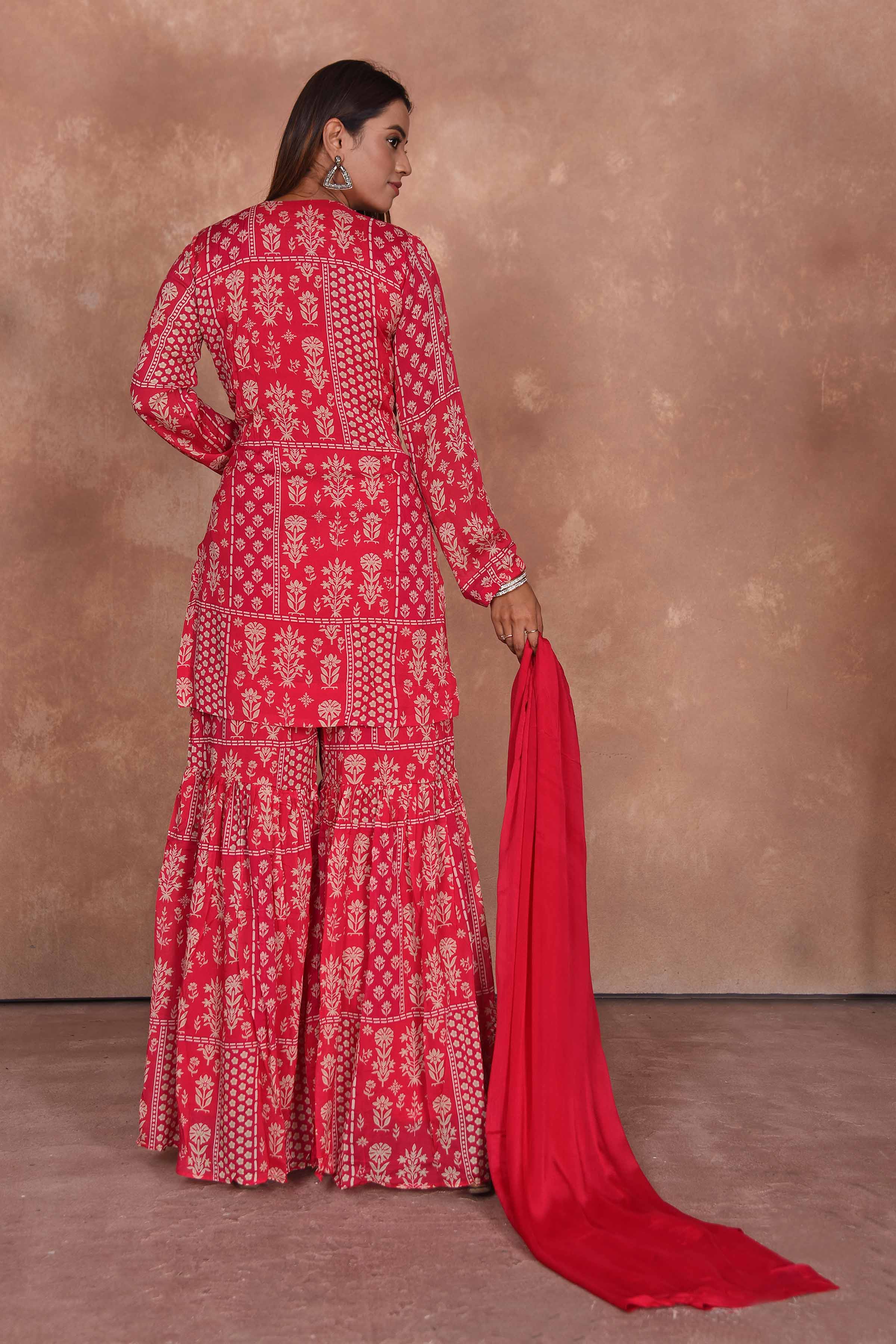 Buy red printed and embroidered sharara suit online in USA with dupatta. Dazzle on weddings and special occasions with exquisite Indian designer dresses, embroidered sarees, partywear sarees, Bollywood sarees, handloom sarees, designer lehenga, Anarkali suits from Pure Elegance Indian clothing store in USA.-back