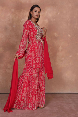 Buy red printed and embroidered sharara suit online in USA with dupatta. Dazzle on weddings and special occasions with exquisite Indian designer dresses, embroidered sarees, partywear sarees, Bollywood sarees, handloom sarees, designer lehenga, Anarkali suits from Pure Elegance Indian clothing store in USA.-side