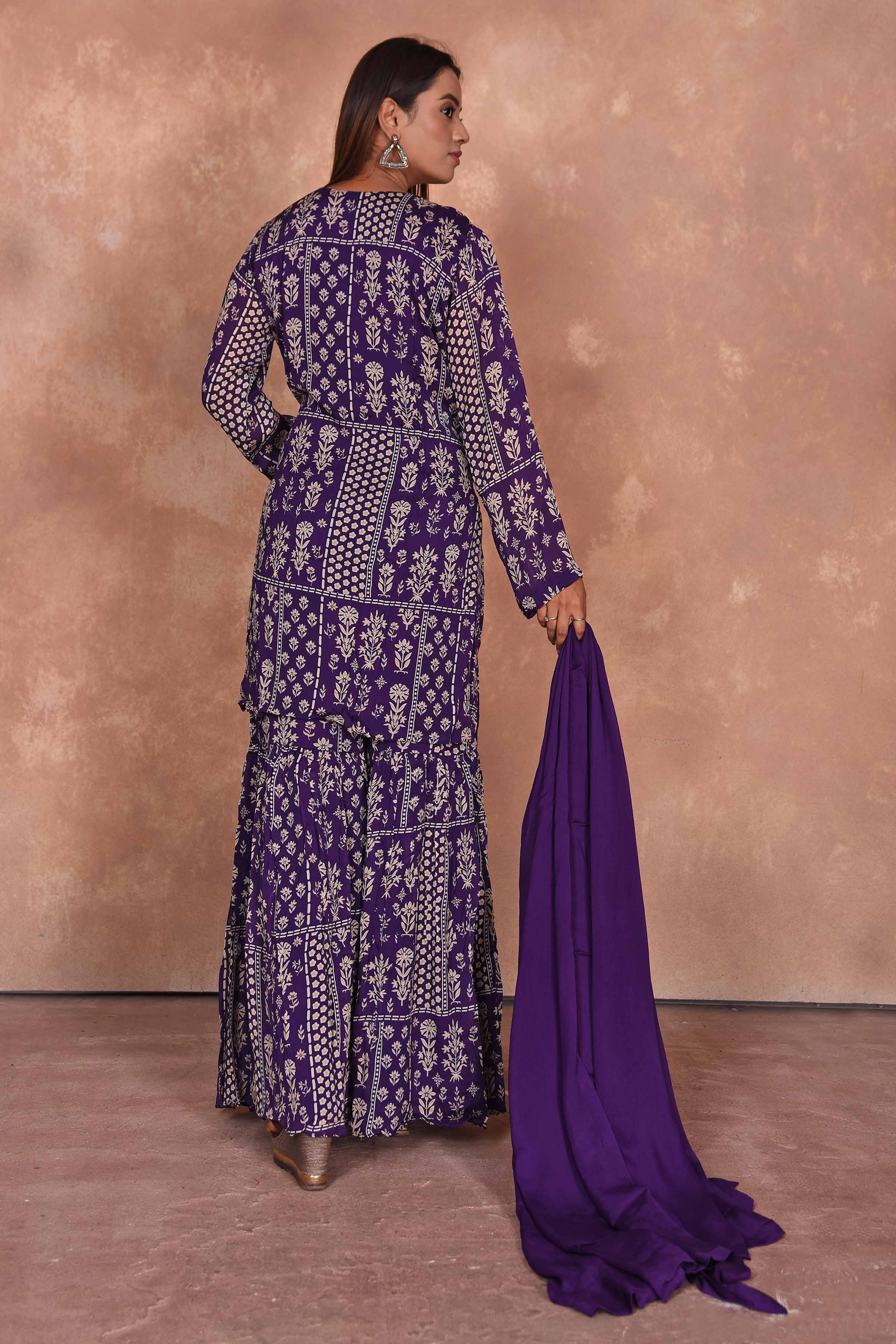 Shop purple printed and embroidered sharara suit online in USA with dupatta. Dazzle on weddings and special occasions with exquisite Indian designer dresses, embroidered sarees, partywear sarees, Bollywood sarees, handloom sarees, designer lehenga, Anarkali suits from Pure Elegance Indian clothing store in USA.-back