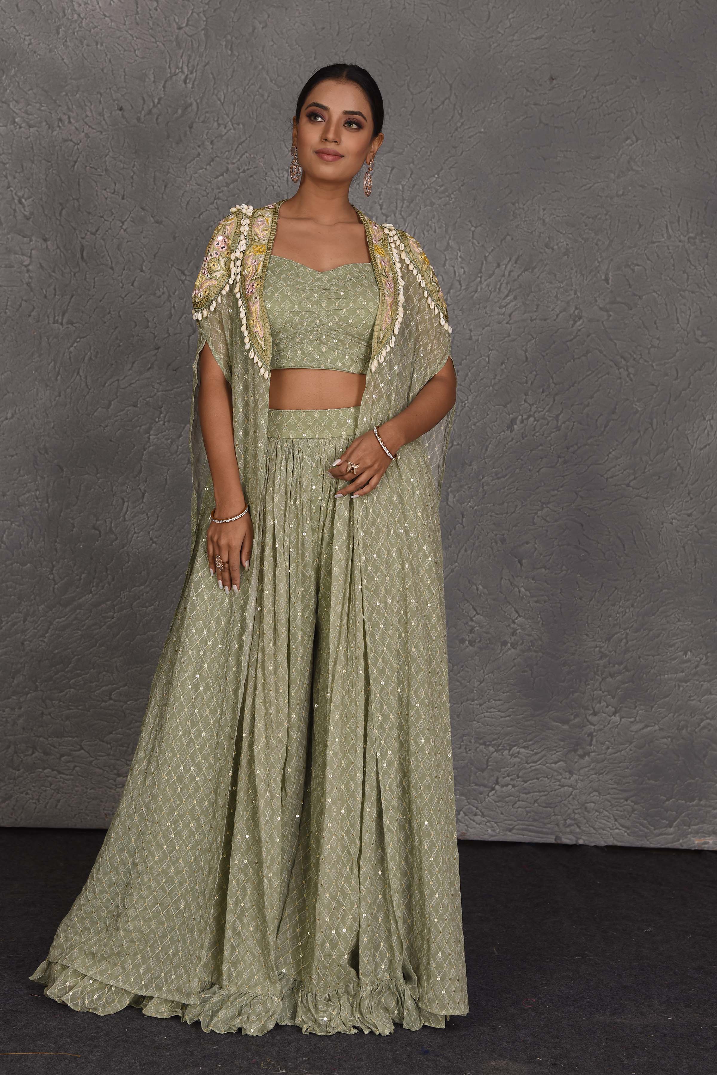 Buy beautiful sage green embroidered sharara pants online in USA with embroidered cape. Flaunt your Indian style on festive occasions in stunning designer lehengas, Anarkali suit, sharara suits, designer gowns, designer sarees, embroidered sarees from Pure Elegance India fashion store in USA. -full view