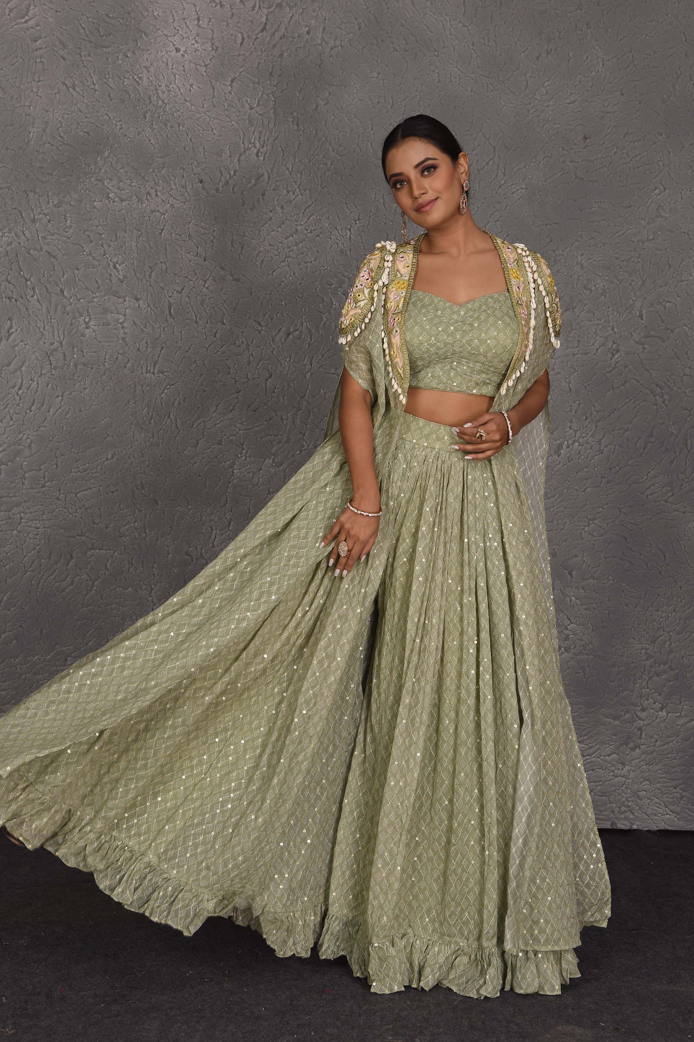 Buy beautiful sage green embroidered sharara pants online in USA with embroidered cape. Flaunt your Indian style on festive occasions in stunning designer lehengas, Anarkali suit, sharara suits, designer gowns, designer sarees, embroidered sarees from Pure Elegance India fashion store in USA. -front