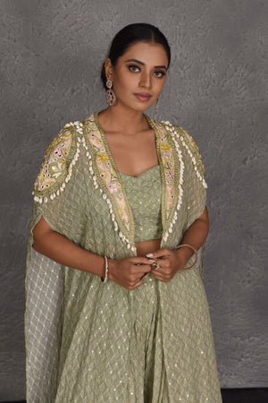Buy beautiful sage green embroidered sharara pants online in USA with embroidered cape. Flaunt your Indian style on festive occasions in stunning designer lehengas, Anarkali suit, sharara suits, designer gowns, designer sarees, embroidered sarees from Pure Elegance India fashion store in USA. -closeup