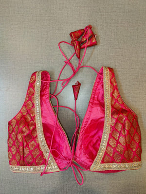 Shop beautiful pink Banarasi sheer saree blouse online in USA. Elevate your Indian saree style with exquisite readymade sari blouse, embroidered saree blouses, Banarasi saree blouse, designer sari blouse, choli-cut blouses from Pure Elegance Indian clothing store in USA.-back