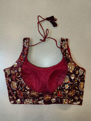 Buy beautiful maroon hand embroidered velvet designer saree blouse online in USA. Elevate your Indian saree style with exquisite readymade sari blouse, embroidered saree blouses, Banarasi saree blouse, designer sari blouse, choli-cut blouses from Pure Elegance Indian clothing store in USA.-back