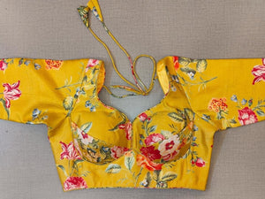 Buy stunning yellow floral print choli-cut saree blouse online in USA. Elevate your Indian saree style with exquisite readymade sari blouse, embroidered saree blouses, Banarasi saree blouse, designer sari blouse, choli-cut blouses from Pure Elegance Indian clothing store in USA.-full view