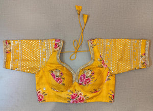 Buy beautiful yellow floral choli-cut saree blouse online in USA with embroidered sleeves. Elevate your Indian saree style with exquisite readymade sari blouse, embroidered saree blouses, Banarasi saree blouse, designer sari blouse, choli-cut blouses from Pure Elegance Indian clothing store in USA.-full view