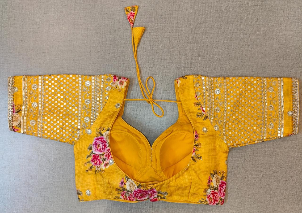 Buy beautiful yellow floral choli-cut saree blouse online in USA with embroidered sleeves. Elevate your Indian saree style with exquisite readymade sari blouse, embroidered saree blouses, Banarasi saree blouse, designer sari blouse, choli-cut blouses from Pure Elegance Indian clothing store in USA.-back