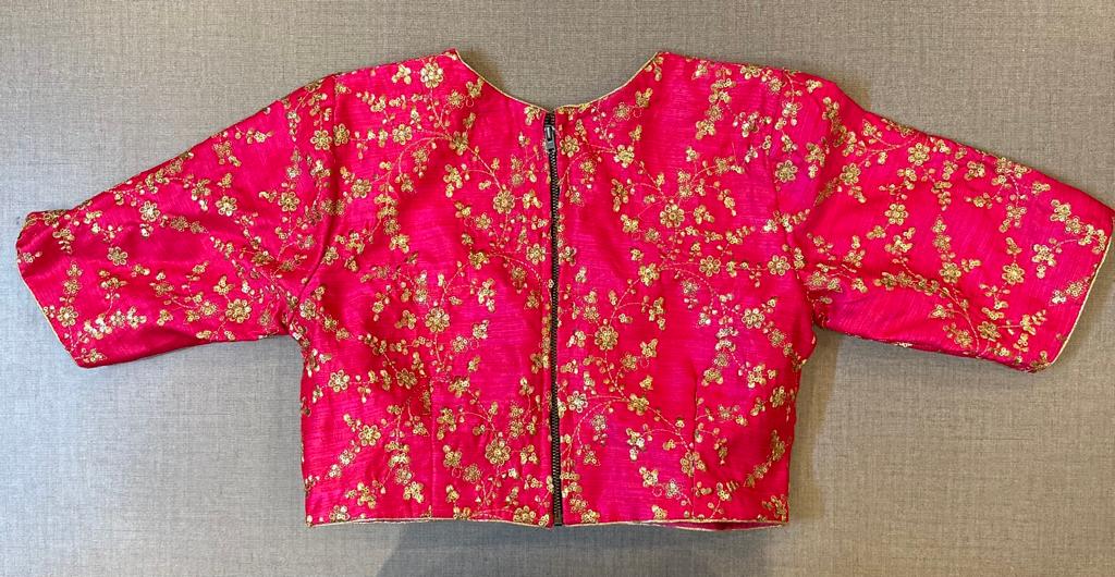 Shop beautiful pink designer saree blouse online in USA with golden embroidery. Elevate your saree style with exquisite readymade saree blouses, embroidered saree blouses, Banarasi saree blouse, designer saree blouse, choli-cut blouses, corset blouses from Pure Elegance Indian clothing store in USA.-back