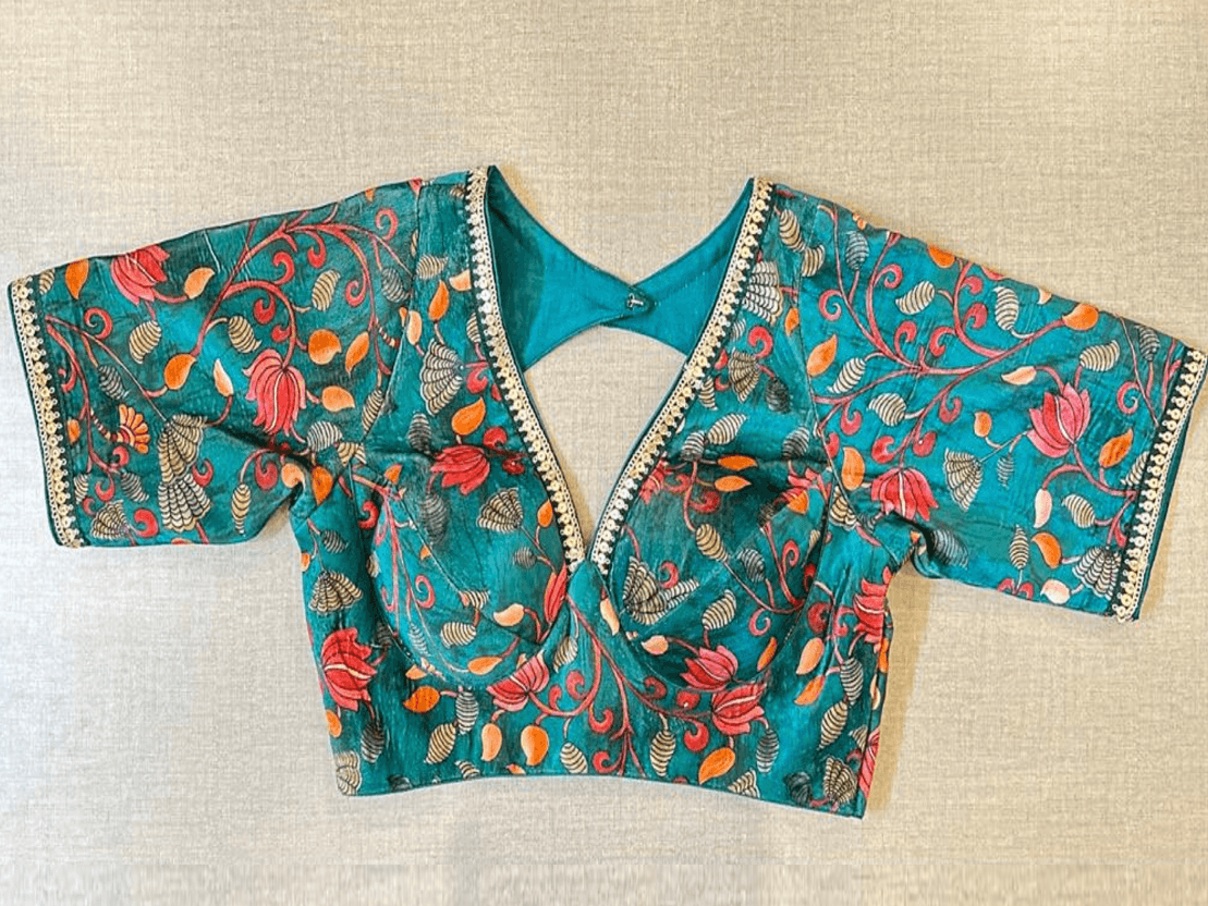 Buy sea green Kalamkari saree blouse online in USA with sequin lace. Elevate your saree style with exquisite readymade saree blouses, embroidered saree blouses, Banarasi saree blouse, designer saree blouse, choli-cut blouses, corset blouses from Pure Elegance Indian clothing store in USA.-full view