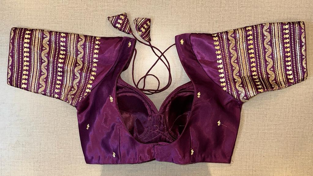 Shop purple choli-cut saree blouse online in USA with golden embroidery. Elevate your saree style with exquisite readymade saree blouses, embroidered saree blouses, Banarasi saree blouse, designer saree blouse, choli-cut blouses, corset blouses from Pure Elegance Indian clothing store in USA.-back