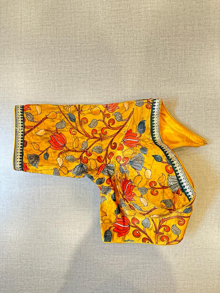 Shop beautiful yellow Kalamkari saree blouse online in USA with sequin lace. Elevate your saree style with exquisite readymade saree blouses, embroidered saree blouses, Banarasi saree blouse, designer saree blouse, choli-cut blouses, corset blouses from Pure Elegance Indian clothing store in USA.-side