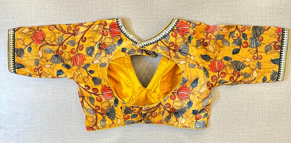 Shop beautiful yellow Kalamkari saree blouse online in USA with sequin lace. Elevate your saree style with exquisite readymade saree blouses, embroidered saree blouses, Banarasi saree blouse, designer saree blouse, choli-cut blouses, corset blouses from Pure Elegance Indian clothing store in USA.-back