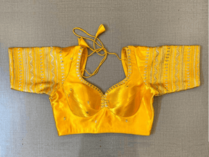 Buy beautiful yellow choli-cut saree blouse online in USA with golden embroidery. Elevate your saree style with exquisite readymade saree blouses, embroidered saree blouses, Banarasi saree blouse, designer saree blouse, choli-cut blouses, corset blouses from Pure Elegance Indian clothing store in USA.-full view