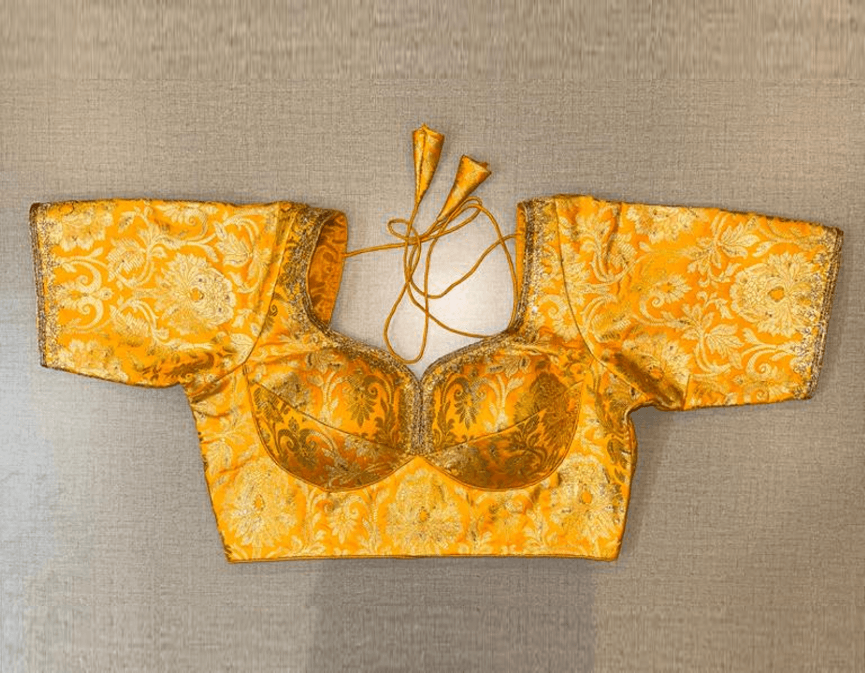 Buy beautiful yellow Banarasi saree blouse online in USA with embroidery. Elevate your saree style with exquisite readymade saree blouses, embroidered saree blouses, Banarasi saree blouse, designer saree blouse, choli-cut blouses, corset blouses from Pure Elegance Indian clothing store in USA.-full view