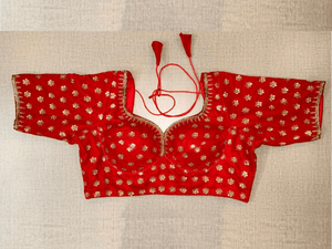 Shop beautiful red velvet embroidered choli-cut saree blouse online in USA. Elevate your saree style with exquisite readymade saree blouses, embroidered saree blouses, Banarasi saree blouse, designer saree blouse, choli-cut blouses, corset blouses from Pure Elegance Indian clothing store in USA.-full view