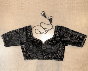 Buy beautiful black velvet embroidered choli-cut saree blouse online in USA. Elevate your saree style with exquisite readymade saree blouses, embroidered saree blouses, Banarasi saree blouse, designer saree blouse, choli-cut blouses, corset blouses from Pure Elegance Indian clothing store in USA.-full view