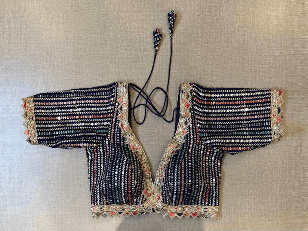 Shop beautiful navy blue sequin and thread embroidery saree blouse online in USA. Elevate your saree style with exquisite readymade saree blouses, embroidered saree blouses, Banarasi saree blouse, designer saree blouse, choli-cut blouses, corset blouses from Pure Elegance Indian clothing store in USA.-full view