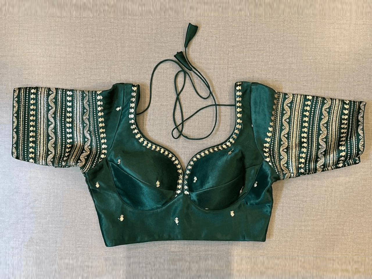 Buy beautiful dark green choli-cut saree blouse online in USA with embroidery. Elevate your saree style with exquisite readymade saree blouses, embroidered saree blouses, Banarasi saree blouse, designer saree blouse, choli-cut blouses, corset blouses from Pure Elegance Indian clothing store in USA.-full view