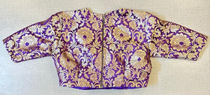 Shop beautiful purple Banarasi saree blouse online in USA. Elevate your saree style with exquisite readymade saree blouses, embroidered saree blouses, Banarasi saree blouse, designer saree blouse, choli-cut blouses, corset blouses from Pure Elegance Indian clothing store in USA.-back