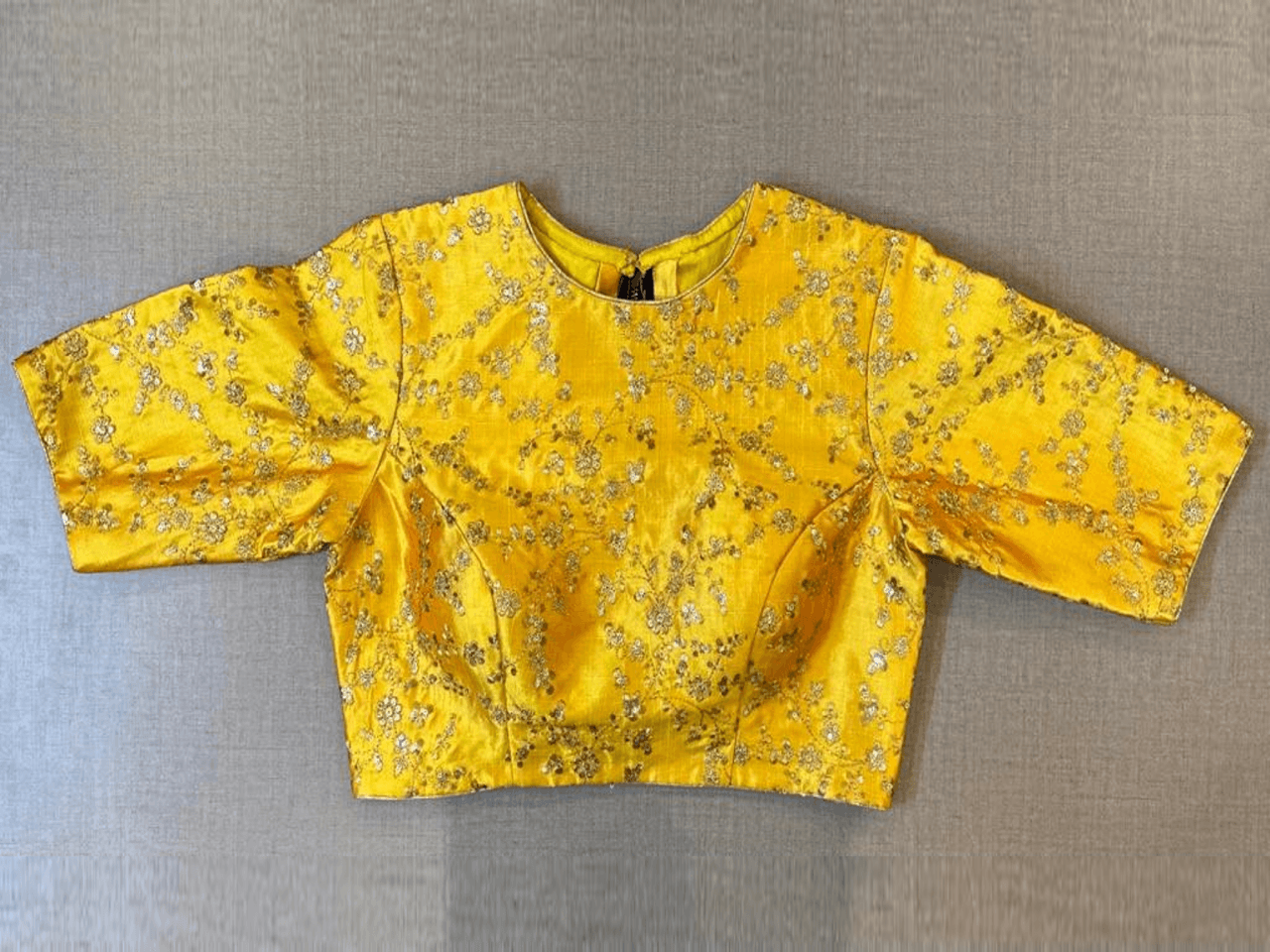 Buy yellow designer saree blouse online in USA with golden embroidery. Elevate your saree style with exquisite readymade saree blouses, embroidered saree blouses, Banarasi saree blouse, designer saree blouse, choli-cut blouses, corset blouses from Pure Elegance Indian clothing store in USA.-full view