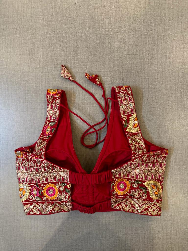 Buy beautiful red heavy embroidery sleeveless saree blouse online in USA. Elevate your saree style with exquisite readymade saree blouses, embroidered saree blouses, Banarasi saree blouse, designer saree blouse, choli-cut blouses, corset blouses from Pure Elegance Indian clothing store in USA.-back